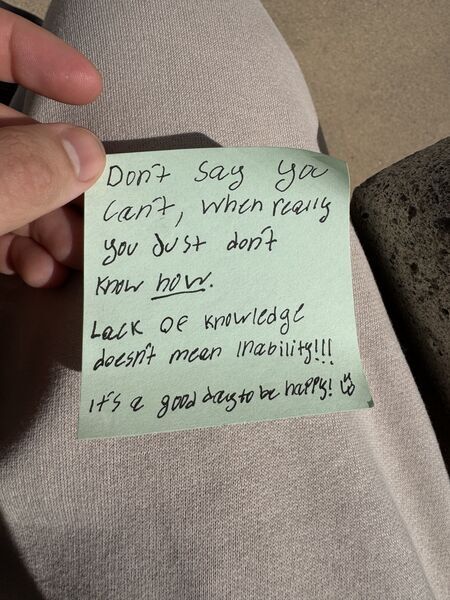Handwritten sticky note with words of encouragement